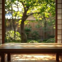 Sunlight streaming through a window with branches, illuminating a wooden table on a sunny day photo