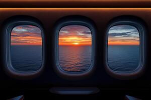 Three aircraft windows offering a breathtaking view of the sea at sunset over the horizon photo