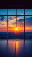 A stunning sunset view through large windows in a modern building showcasing vibrant colors photo