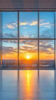 A stunning sunset view through large windows in a modern building showcasing vibrant colors photo