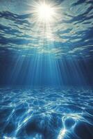 Light rays penetrate clear water creating a serene underwater atmosphere at midday photo