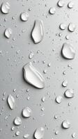 Raindrops on a smooth surface with a soft grayscale background in natural light photo