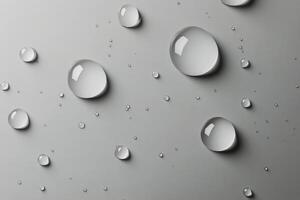 Raindrops on a smooth grey surface creating intriguing patterns and reflections photo