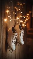 Elegant white ice skates hanging by twinkling lights in a cozy indoor setting during winter photo