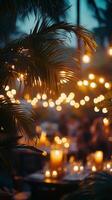 A summer evening gathering with warm lights in a tropical setting surrounded by lush greenery photo