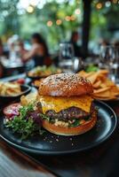 Delicious cheeseburger served with fresh salad and sides at a cozy restaurant during dinner time photo