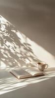 A cozy reading corner with an open book and a cup of coffee in soft morning light photo