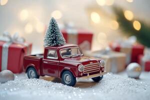 Red toy truck with Christmas tree on top among wrapped presents and holiday decorations photo