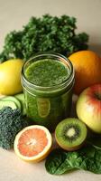 Fresh green smoothie with fruits and vegetables on a wooden countertop in natural light photo