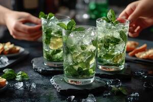 Refreshing mojito cocktails served with fresh mint at a lively gathering in a cozy bar setting photo