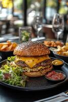 Delicious cheeseburger served with fresh salad and sides at a cozy restaurant during dinner time photo