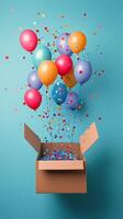 Colorful balloons emerging from a white box against a light blue background photo