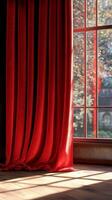Red velvet curtains illuminated by a spotlight in a wooden theater setting during a performance photo