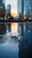 Ripples expanding in dark water under rain creating a calm and tranquil atmosphere photo