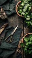 Indoor gardening setup featuring fresh herbs, scissors, and lush green leaves on a wooden table photo