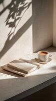 A cozy reading corner with an open book and a cup of coffee in soft morning light photo