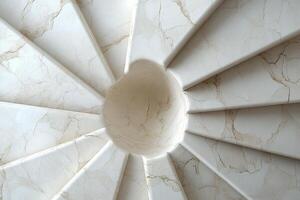 Elegant spiral staircase captured from above in a historic building with intricate design details photo