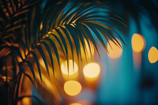 Lush palm leaves illuminated by soft bokeh lights indoors during an evening gathering photo