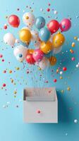 Colorful balloons emerging from a white box against a light blue background photo