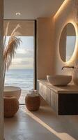 Elegant bathroom design featuring a modern basin and illuminated mirror overlooking the sea photo