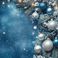 Beautiful blue and silver ornaments hanging on a Christmas tree with a winter background photo