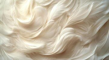 Soft and flowing white feathers create a delicate texture against a light background photo