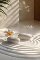 Tranquil arrangement of stones and flowers on textured sand pattern in a serene setting photo