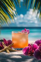 Relaxing beach scene with a tropical cocktail and flowers during a sunny day by the sea photo