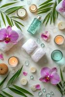 Elegant spa arrangement with towels, candles, and floral decorations set on a soft backdrop photo