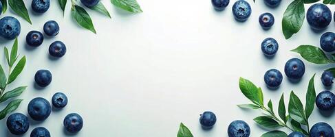 Fresh blueberries surrounded by green leaves on a light background, perfect for a healthy dessert photo