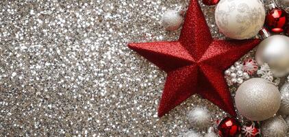 Shiny red star ornament and silver ball surrounded by festive decorations for the holiday season photo