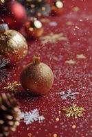 Holiday arrangement with gold ornaments and festive elements on a red background photo