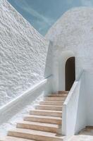 Stunning interior staircase carved from natural stone bathed in soft light photo