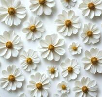 White flowers with yellow centers arranged beautifully on a light surface for decoration photo