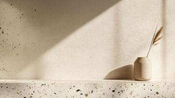 Beige Vase with Dried Grass on a Terrazzo Shelf in a Minimalist Setting photo