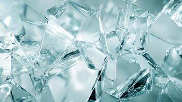 Close-up of Shattered Glass with Sharp Edges and a Teal Tint photo