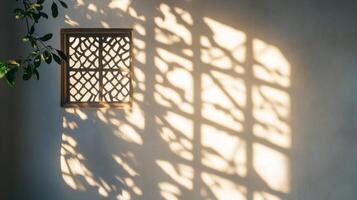 Sunlight Streaming Through a Window Casts a Geometric Shadow on a White Wall photo