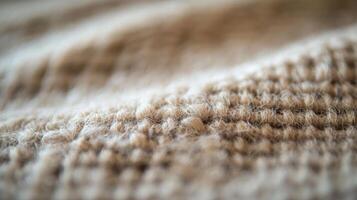 Close-up of a Soft, Tan Knit Fabric with a Fuzzy Texture photo