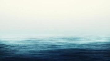 Calm Ocean Surface with Misty Horizon photo