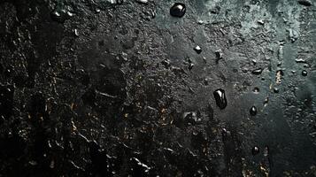 Black Textured Surface with Water Droplets photo