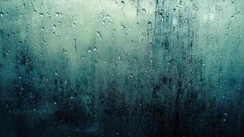 Raindrops on a Windowpane with a Greenish Hue photo