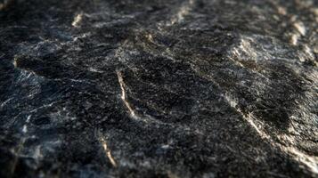 Close-up of Dark Grey Rock Surface with Veins and Texture photo