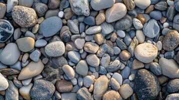 A Close-Up View of Smooth, Colorful Pebbles on a Beach photo