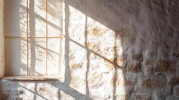 Window Light Casting a Grid Pattern on a Stone Wall photo