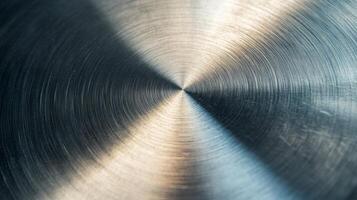 Close-up of a Circular Brushed Metal Surface with Light Reflecting photo