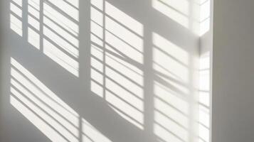 Window Light Casts Horizontal Shadow Lines on a White Wall photo