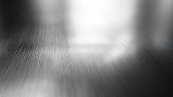 A close-up view of a brushed metal surface with light reflection. photo