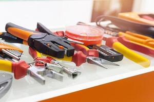 Different electrical tools on display in the store window photo