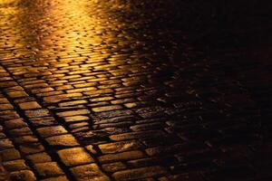 Cobblestone path with golden sunlight of the evening city photo