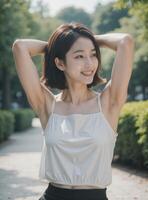 A woman with short hair and a white tank top photo